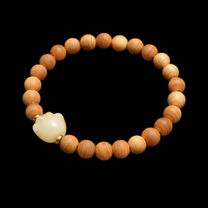 Cypress wood bead bracelet with round cat paw charm and small gold-tone accents